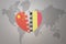 Puzzle heart with the national flag of china and belgium on a world map background. Concept