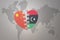 Puzzle heart with the national flag of china and libya on a world map background. Concept