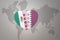 Puzzle heart with the national flag of qatar and mexico on a world map background.Concept