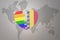 Puzzle heart with the rainbow gay flag and romania on a world map background. Concept