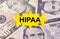 Puzzle with the image of dollars in the center of the inscription -HIPAA