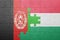 puzzle with the national flag of afghanistan and hungary