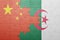 puzzle with the national flag of algeria and china