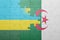 puzzle with the national flag of algeria and rwanda