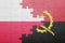 puzzle with the national flag of angola and poland