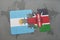 puzzle with the national flag of argentina and kenya on a world map