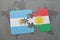 puzzle with the national flag of argentina and kurdistan on a world map