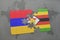 puzzle with the national flag of armenia and zimbabwe on a world map