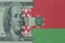 puzzle with the national flag of belarus and dollar money banknote. macro.concept