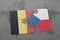 Puzzle with the national flag of belgium and czech republic on a world map background.