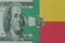 puzzle with the national flag of benin and dollar money banknote. macro.concept