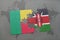 puzzle with the national flag of benin and kenya on a world map