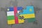 puzzle with the national flag of central african republic and rwanda on a world map