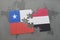 puzzle with the national flag of chile and yemen on a world map background.