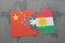 puzzle with the national flag of china and kurdistan on a world map background.