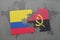puzzle with the national flag of colombia and angola on a world map