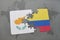 puzzle with the national flag of cyprus and colombia on a world map
