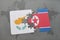 puzzle with the national flag of cyprus and north korea on a world map