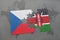 puzzle with the national flag of czech republic and kenya on a world map