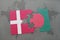 puzzle with the national flag of denmark and bangladesh on a world map background.