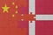 puzzle with the national flag of denmark and china . macro.concept