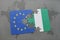 puzzle with the national flag of european union and nigeria on a world map background.