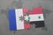 puzzle with the national flag of france and syria on a world map background.