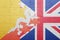 Puzzle with the national flag of great britain and bhutan