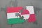 puzzle with the national flag of hungary and greenland on a world map