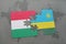 puzzle with the national flag of hungary and rwanda on a world map