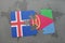 puzzle with the national flag of iceland and eritrea on a world map