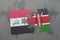 puzzle with the national flag of iraq and kenya on a world map background.