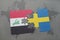 puzzle with the national flag of iraq and sweden on a world map background.