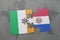 puzzle with the national flag of ireland and paraguay on a world map