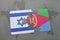 puzzle with the national flag of israel and eritrea on a world map background.