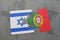 puzzle with the national flag of israel and portugal on a world map background.