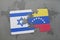 puzzle with the national flag of israel and venezuela on a world map background.
