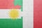 Puzzle with the national flag of italy and kurdistan