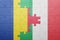 Puzzle with the national flag of italy and romania