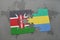 puzzle with the national flag of kenya and gabon on a world map