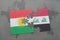 puzzle with the national flag of kurdistan and iraq on a world map background.