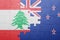 Puzzle with the national flag of lebanon and new zealand