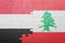 Puzzle with the national flag of lebanon and yemen