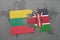 puzzle with the national flag of lithuania and kenya on a world map