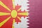 Puzzle with the national flag of macedonia and qatar