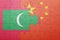 Puzzle with the national flag of maldives and china