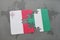 puzzle with the national flag of malta and nigeria on a world map