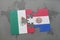 puzzle with the national flag of mexico and paraguay on a world map background.