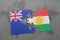 Puzzle with the national flag of new zealand and kurdistan on a world map background. 3D illustration