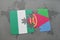 puzzle with the national flag of nigeria and eritrea on a world map